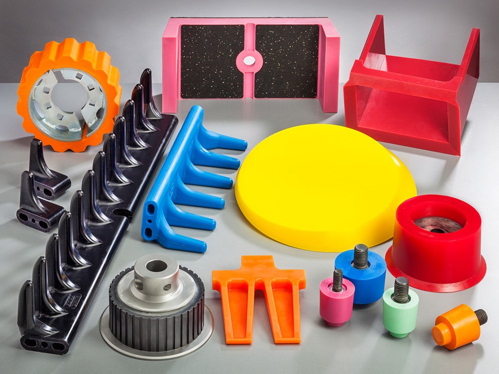 Übersicht verschiedener Formteile aus Gieß-Elastomer in unterschiedlichen Farben und Formen Gieß-Elastomer Formteile aus Polyurethan für formstabile technische Lösungen